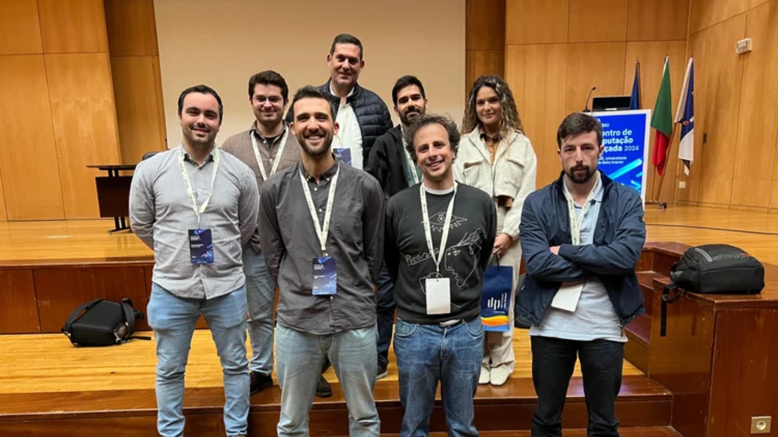 Seven men and a woman, Deucalion researchers, standing in a set of stairs.