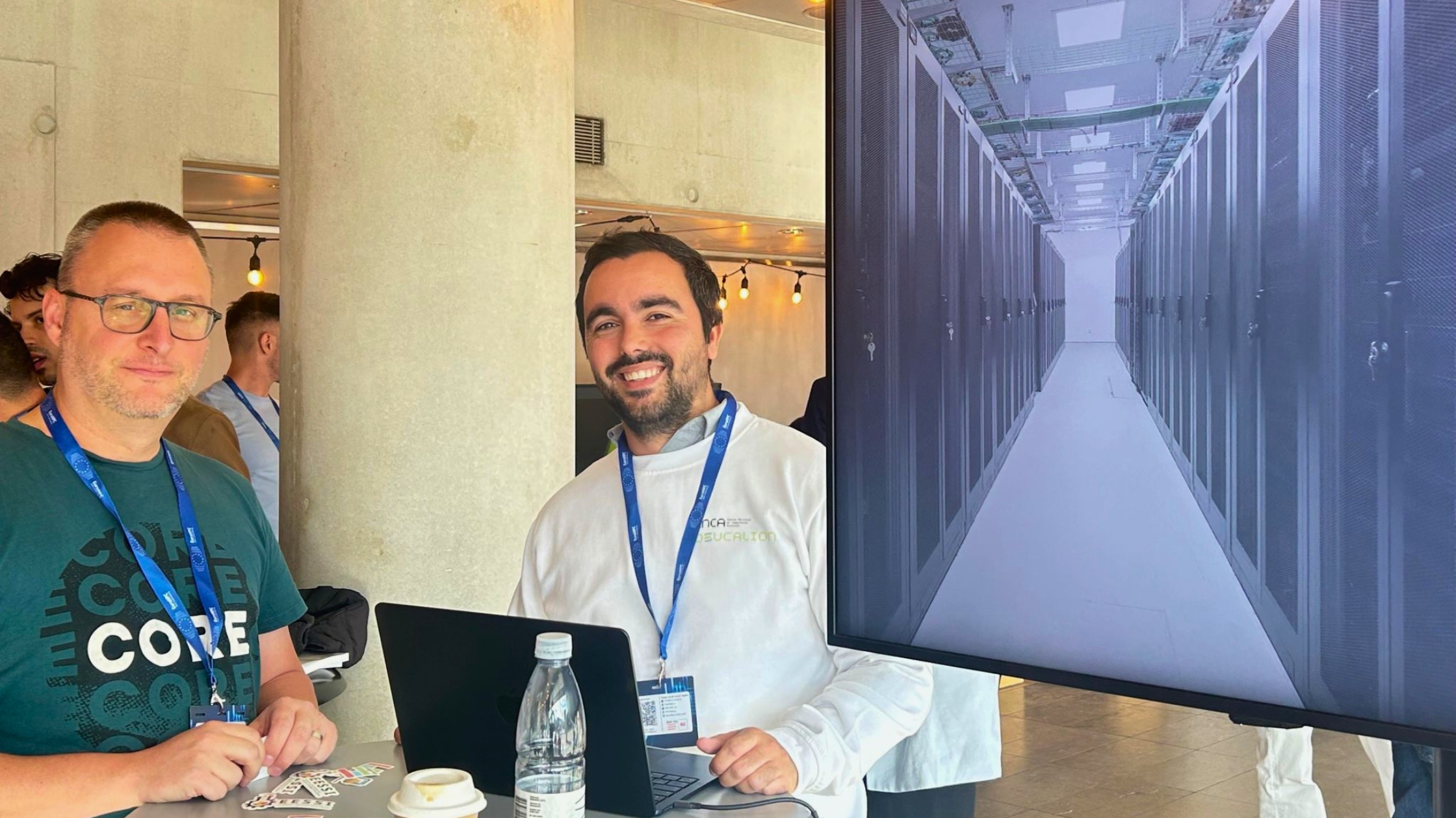 Two male researchers from Deucalion at the EuroHPC User days 2025.