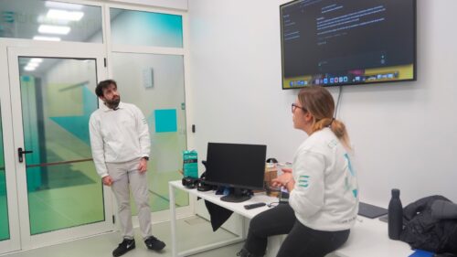 Two researchers talking in a room.