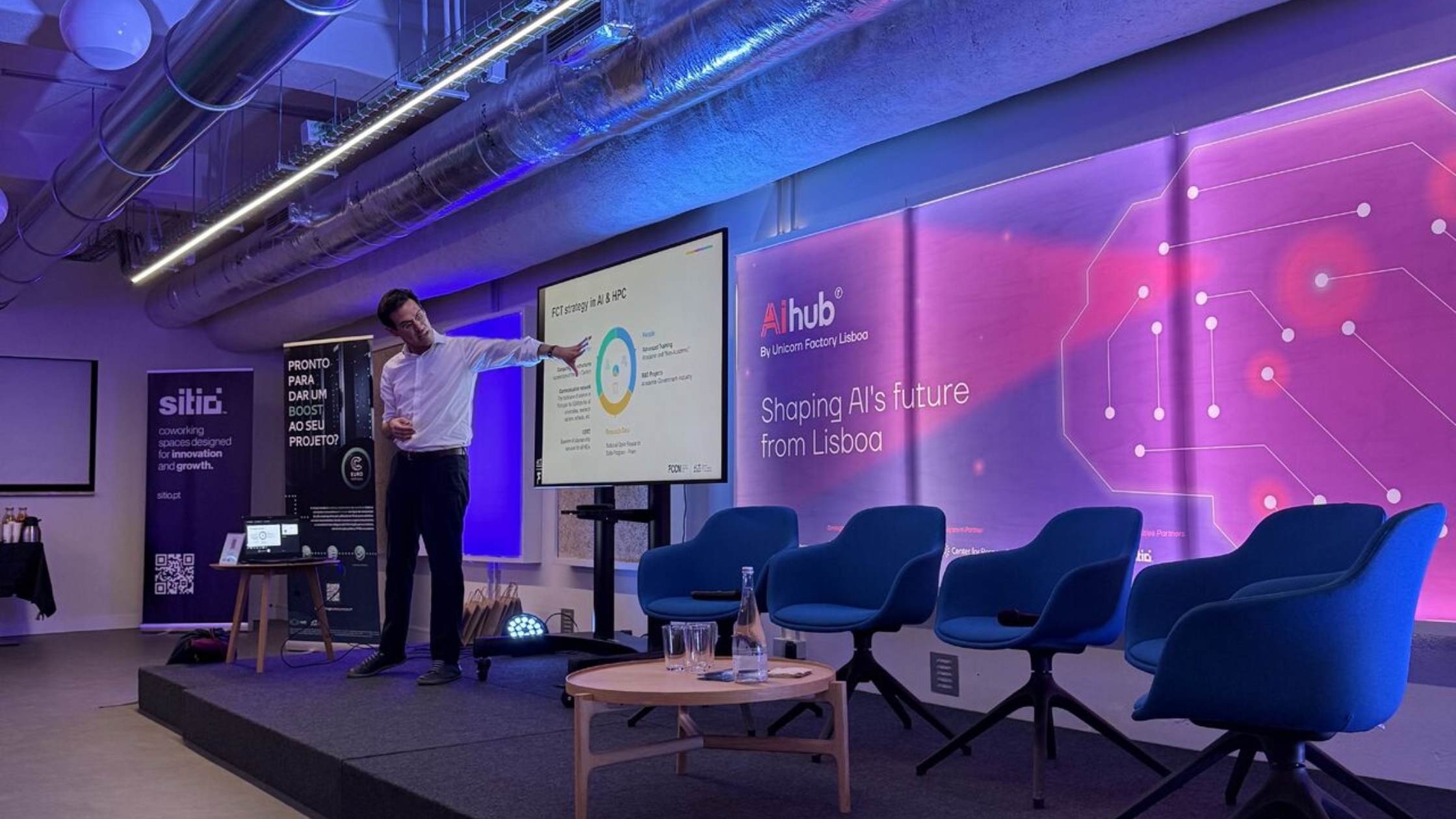 Speaker presenting an AI and high-performance computing session on stage.